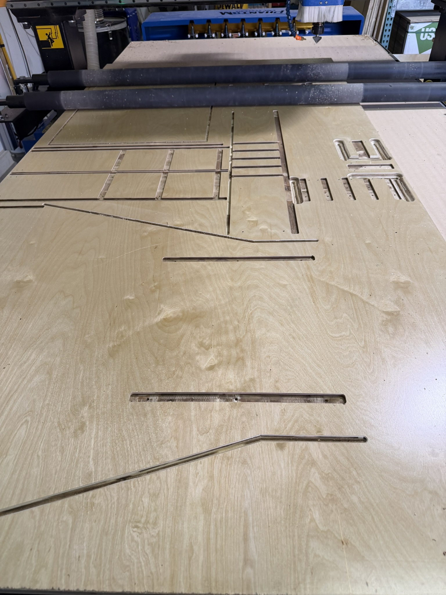 CNC router cutting cabinet panels at Hatley Construction
