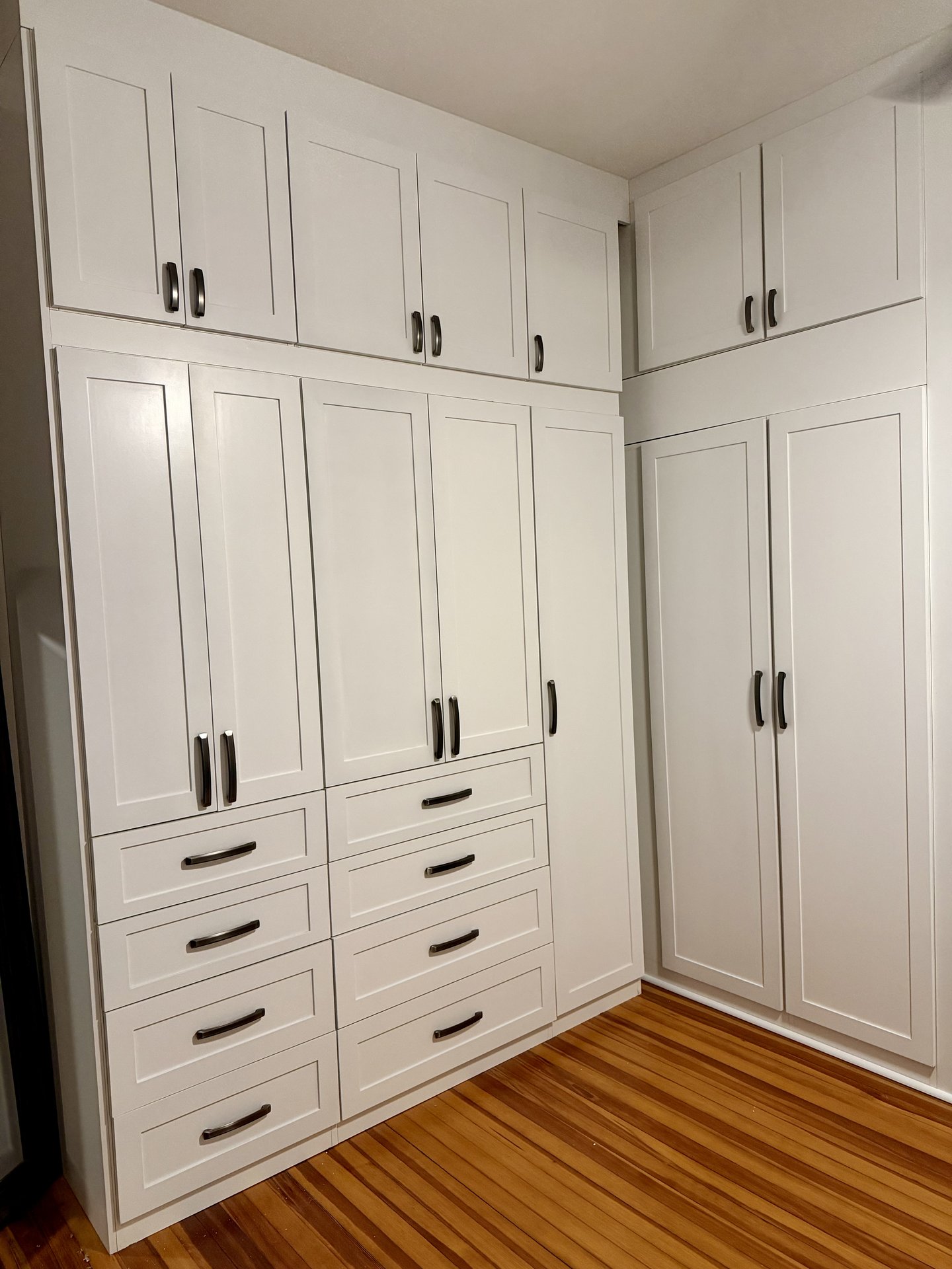 White floor-to-ceiling shaker built-in cabinets
