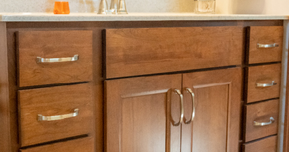 Partial overlay cabinets showing exposed face frame between doors