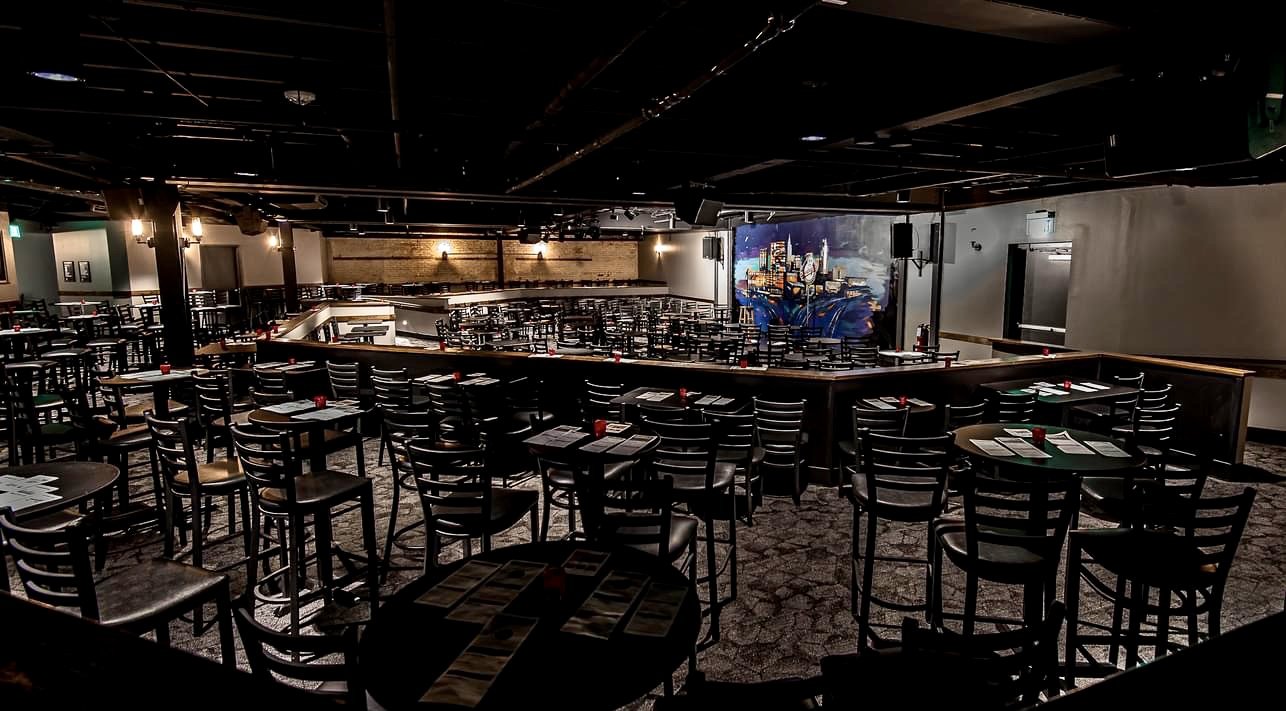 Full dining room with bar seating stage and custom millwork