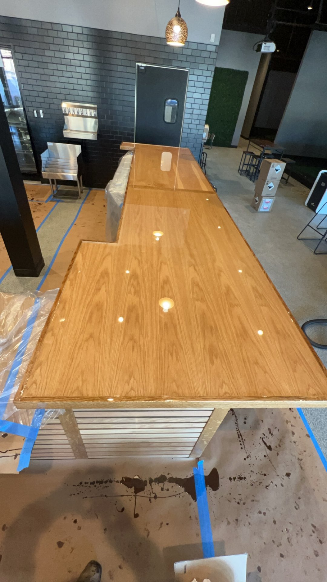 Butcherblock bar top being finished on site with slatted base