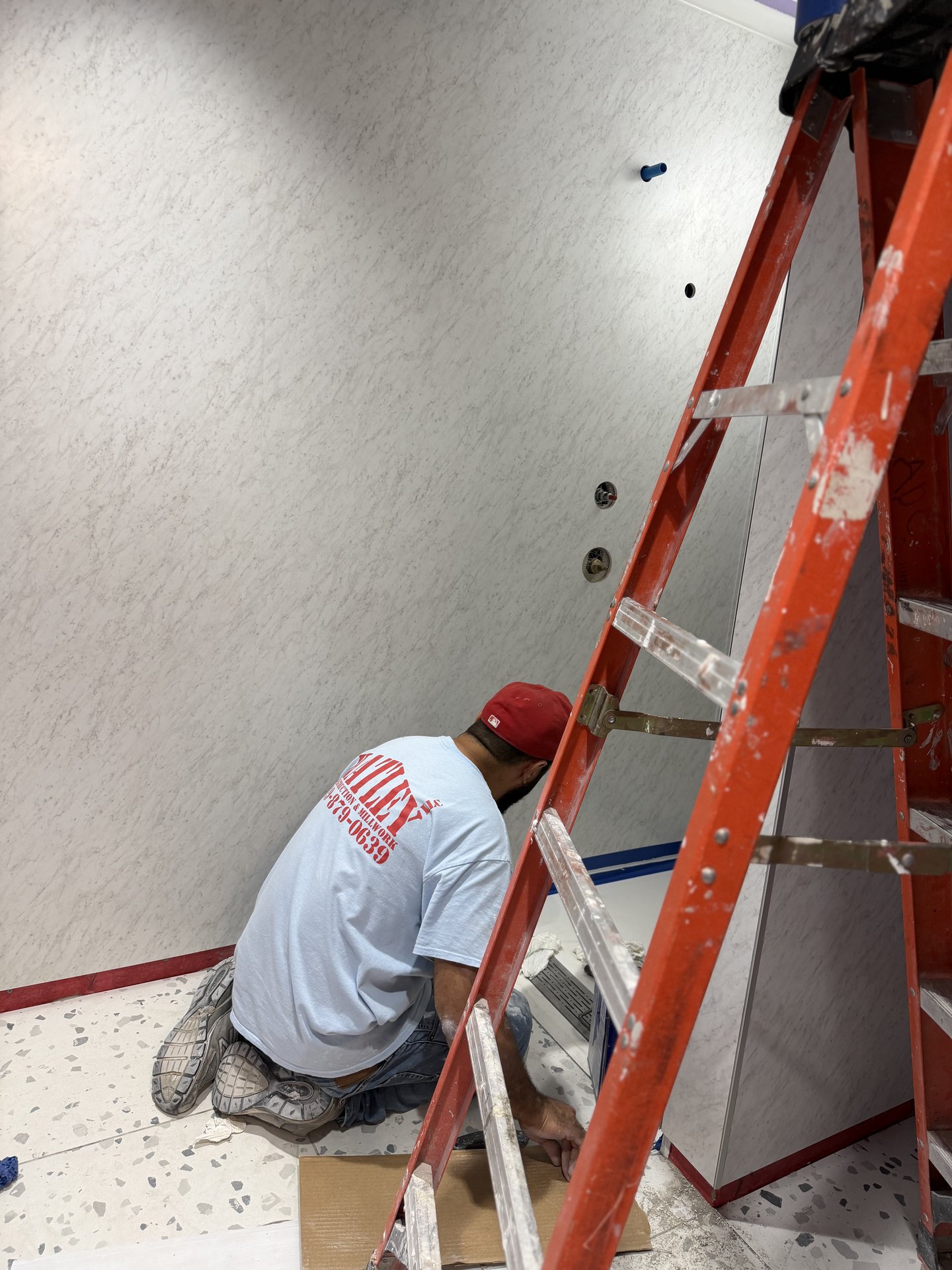 Hatley crew installing Wetwall panels