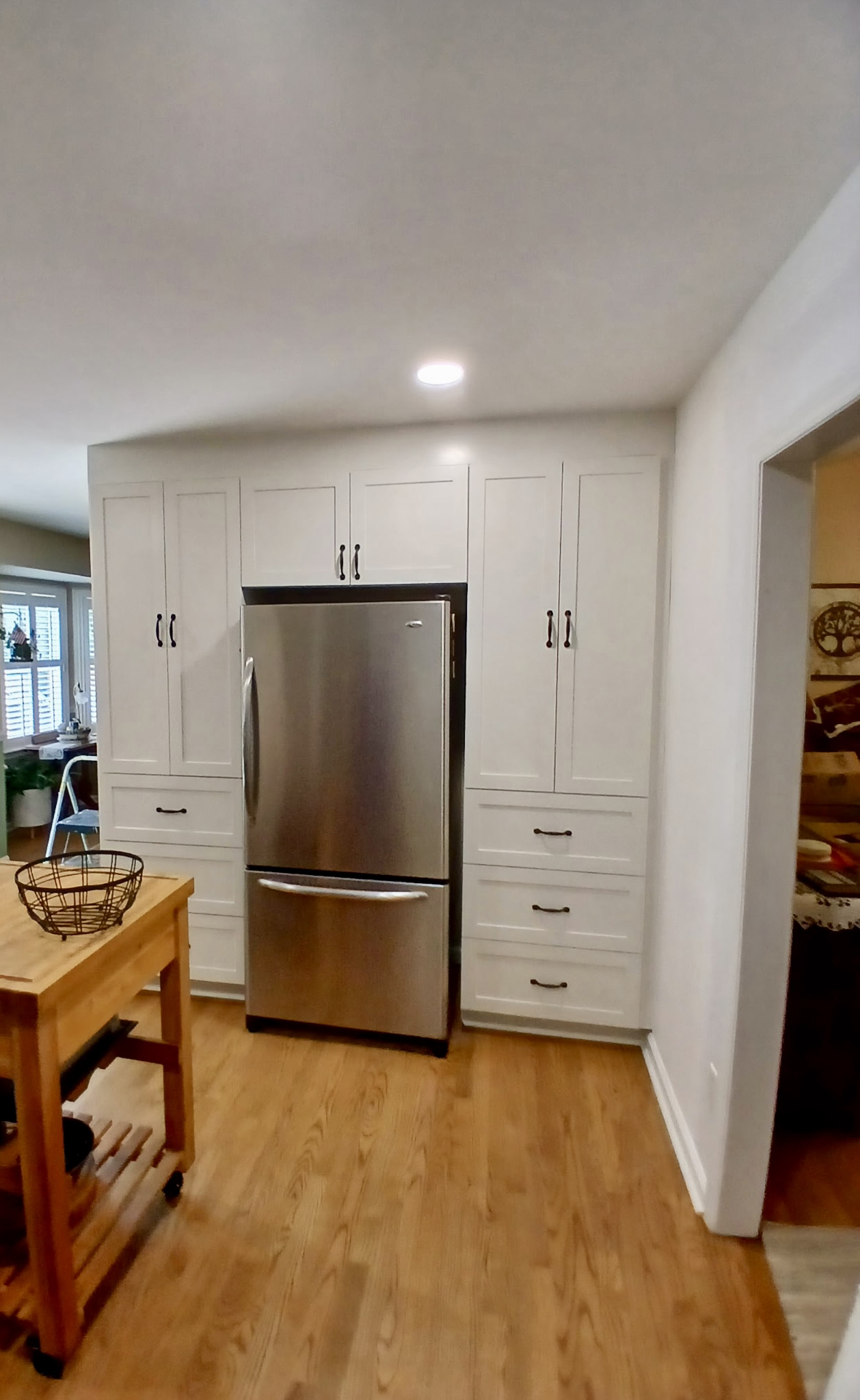 White shaker pantry built-in around fridge