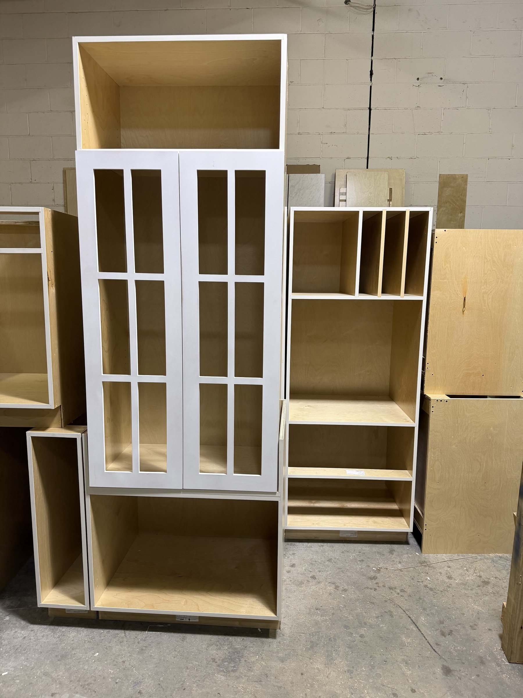 Finished custom cabinets staged in Hatley shop